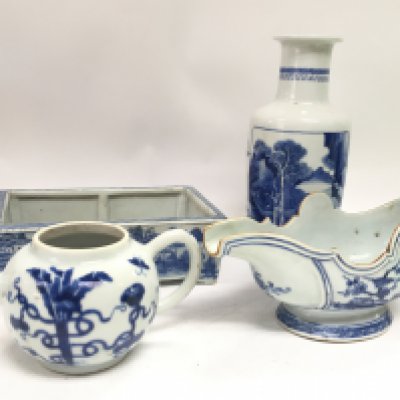 A collection of Chinese blue and white ceramics including a sauce jug with floral and bird design, a rouleau vase with landscape design, a teapot and a flower pot. Hairline cracks as seen. This lot cannot be posted