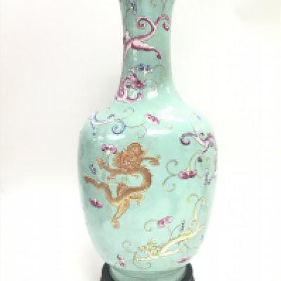 A Chinese Famille Rose Turquoise ground dragon vase , with six character mark to the base. Approximately 33cm tall. No obvious damage or restoration. This lot cannot be posted