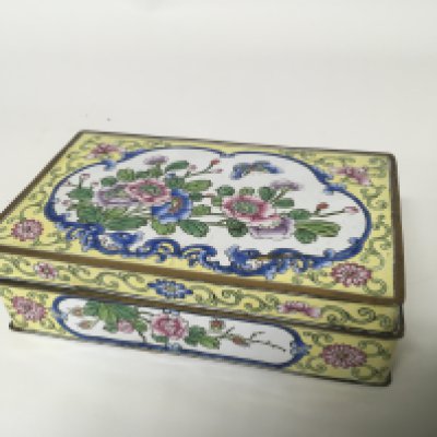 A Chinese yellow enamel box of rectangular shape with a hinged lid 16cmx10cm