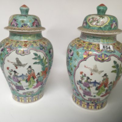A pair of Chinese export porcelain jars and covers 20th century painted with panels of figures within a garden landscape and a large reproduction Chinese punch bowl (3) Hight 38cm.