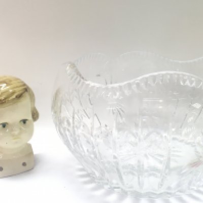 A ceramic doll head and a cut glass bowl . 13 and 15cm tall. This lot cannot be posted