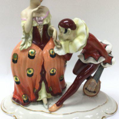 A Royal Dux porcelain Pierrot figure group , 29cm tall. This lot cannot be posted