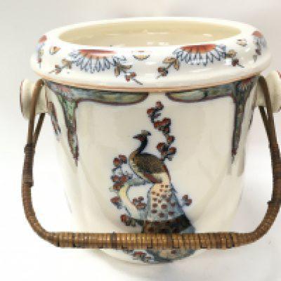 A large Victorian ceramic pail decorated with peacocks, 18.5cm tall and 33cm wide. This lot cannot be posted