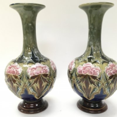 A pair of Royal Doulton Lambeth floral design vases by Eliza Simmance , 20cm tall. Postage category C