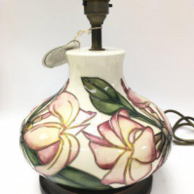 A Moorcroft Frangipani ceramic lamp, this lot cannot be posted. Approximately 28cm tall.