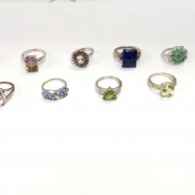 A collection of 10 assorted silver rings set with various stones. Postage B