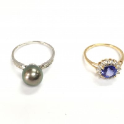 An 18ct white gold ring set with pearl 3.5g and size S and a 14ct yellow gold stone set ring 2.37g size N 1/2