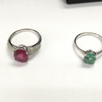 Two 18ct white gold rings set with assorted stones. 7.50g total size R 1/2 and P 1/2 Postage B