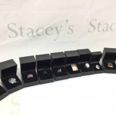 A collection of boxed silver rings set with various gemstones including Sky Blue Topaz, Ruby etc. postage category B