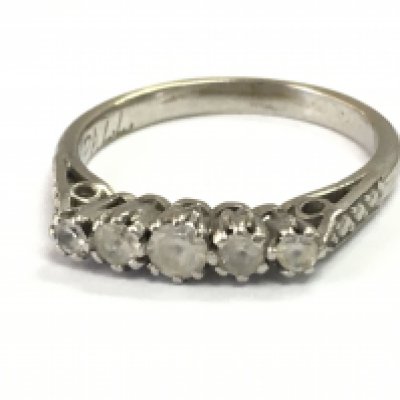 A Palladium 5 stone ring ,size K. Postage category A