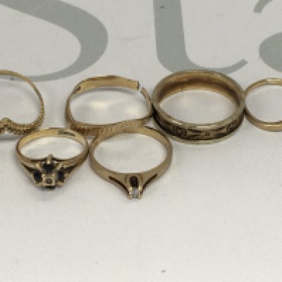 A collection of six 9 ct gold rings including gemstone inset . Total weight 7 grams.
