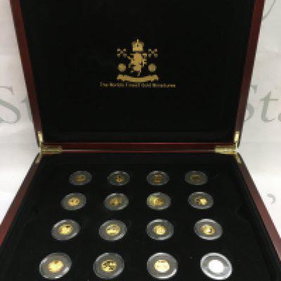 A cased set of The Worlds Finest Gold Miniatures Geoffrey Howard issue with 16 gold miniatures , approximately 1.2/1.3g per coin . With certification booklet. Postage category B