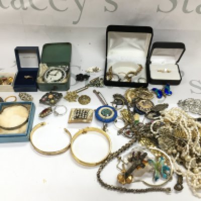 A collection of costume jewellery including some Silver, brooches, necklaces, rings , a 9 carat gold ring (1.3g), small 9ct necklace with a pearl pendant , Ingersoll pocket watch etc. Postage category B