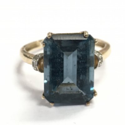 A 9 carat gold blue topaz cocktail ring , size R. 4.3g total weight. Postage category A