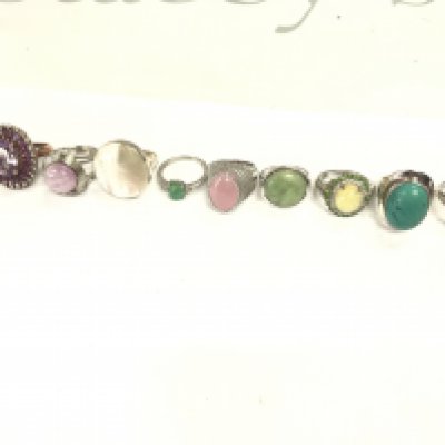 A Collection of silver rings . Postage category A