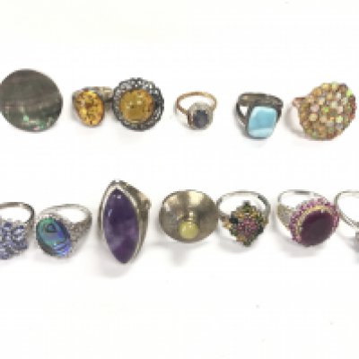 A collection of silver and costume rings . Postage cat A
