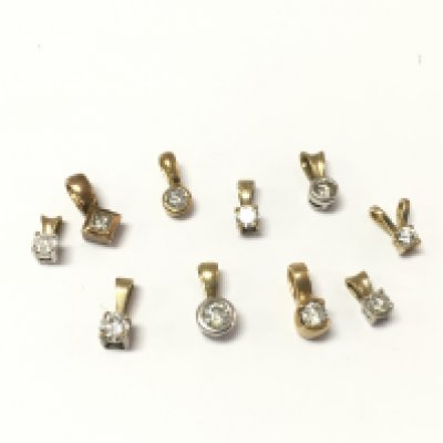 A collection of 9ct gold diamond pendants. 5.32g Postage A