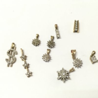 A collection of 9ct gold diamond pendants. 11.45g