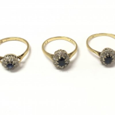 Three 18ct gold sapphire and diamond cluster rings. 8.25g