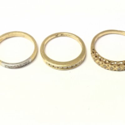 Three 18ct gold diamond half hoop rings. 7.28g size K J and M