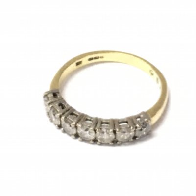 An 18ct gold diamond 7 stone ring. Size P and 3.35g Postage A