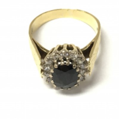 An 18ct gold sapphire and diamond cluster ring. Size M and 5.5g