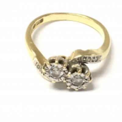 An 18ct gold diamond twist ring. Size N and 3.97g