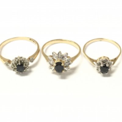Three 9ct gold sapphire and diamond cluster rings. 5.73g