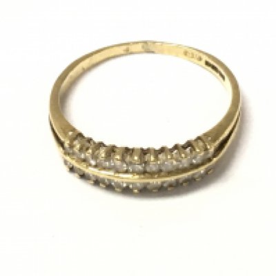 An 18ct gold double row diamond band ring. Size P 1/2 and 2.3g