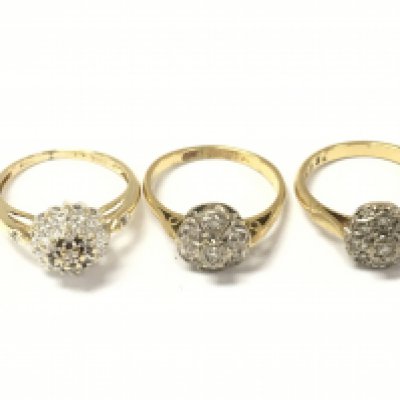 Three 18ct gold diamond cluster rings. 8.89g