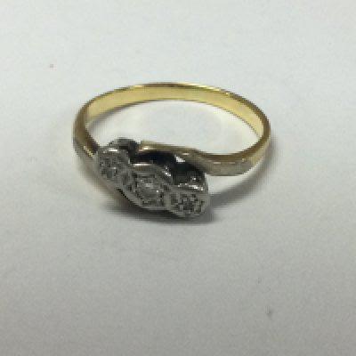 A unmarked ring inset with diamond chips .