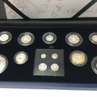 A case set of silver coins The Queens 80 th birthday day collection.