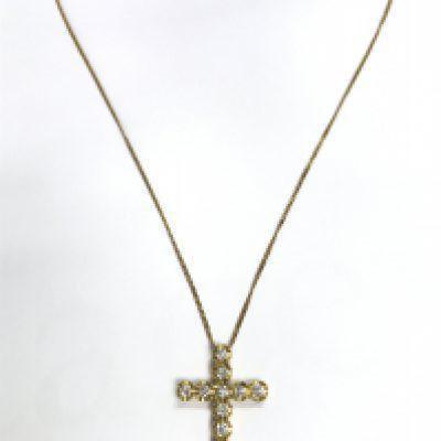A 9ct gold diamond cross on chain , 10g total weight. Postage category A