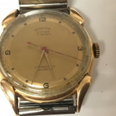 A rare Vintage Swiss 18carat gold cased Norda 17 Jewel manual wind gents wrist watch serial number 2534 seen working with a later replacement strap.