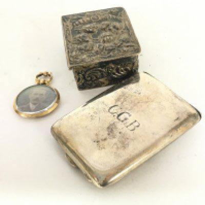 A 9carat gold double sided portrait pendent a silver match holder and small silver box (3)