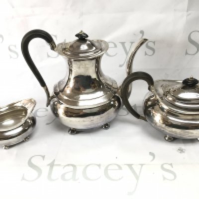 A three piece silver Sheffield hallmarked tea set. 1440g