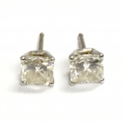 A pair of nice quality princess cut diamond earrings. Each diamond is approximately 1.2ct. Postage A