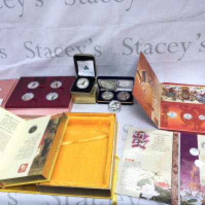 A collection of Chinese coinage including a number of silver 1 oz coins and Qing Dynasty coins. Postage B