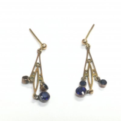 A pair of unmarked gold earrings set with small blue sapphires, approx 1.5g. Shipping category A. NO RESERVE