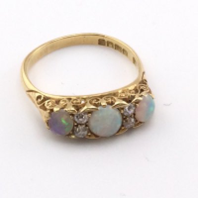 An 18ct Edwardian opal and diamond set ring. 4.33g and size O