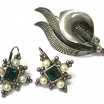 A silver brooch made in Denmark and a pair of earrings , postage category A. NO RESERVE