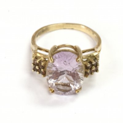 A 9ct gold ring set with a pink gemstone, size P/Q. 4.3g total weight Postage category A