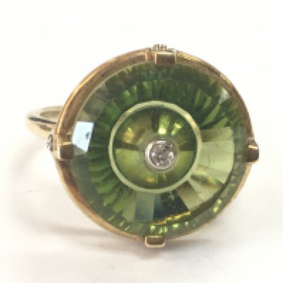 A 9ct gold green quartz and diamond stone ring. P/Q .4.4g total weight. Postage category A