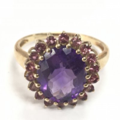 A 9ct gold purple amethyst and rhodolite ring, size R/S. 4g total weight. postage category A