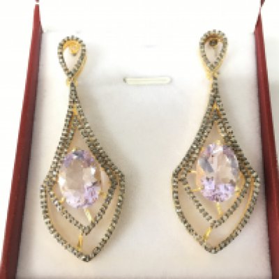 A pair of chandelier style long drop earrings in silver gilt set with oval Kunzite and diamonds. Kunzites 12.00ct approx. Diamonds 1.25ct. Postage B