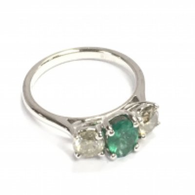 An 18ct white gold emerald and diamond trilogy ring. Emerald 0.66ct and diamonds 0.37ct size M. Comes with gem cert.
