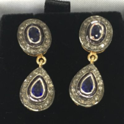 A pair of double drop earring set with pear shaped and oval sapphires each surrounded by RC diamond in gold plated silver. Approximately 0.75vt sapphire and 0.48ct diamonds. Postage B