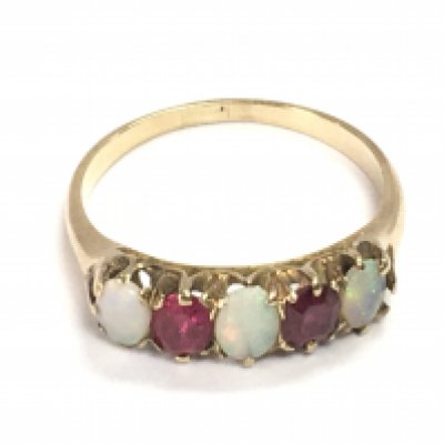 An unmarked ruby and opal ring size P 1/2 and 2.92g Postage A