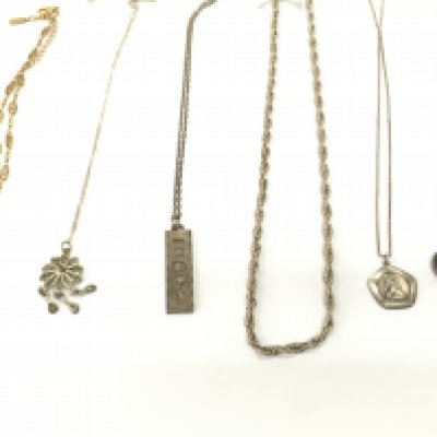 Collection of silver chains and other including a silver ingot on necklace. Postage B