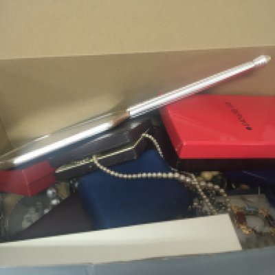 A box containing a collection of costume jewellery and oddments watches.